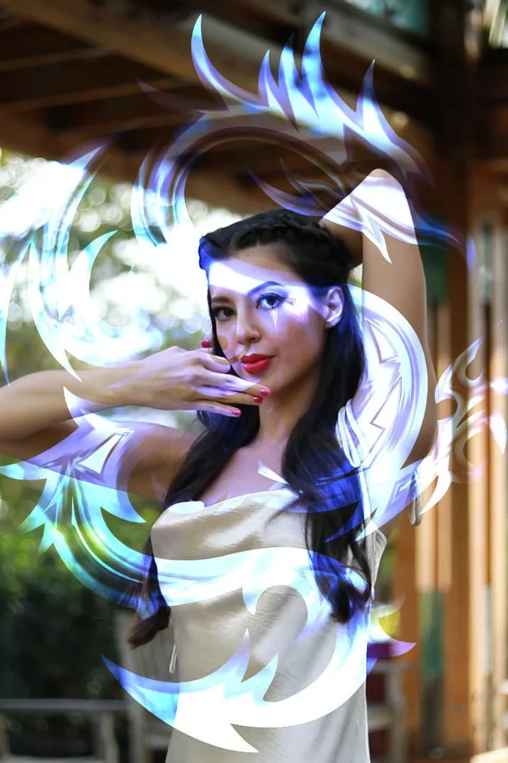 Jasmine KaiSa Rose wreathed in the blue light of the Solar Dragons